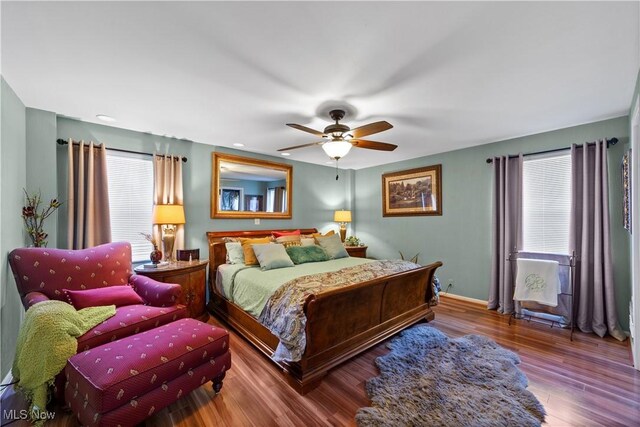 18975 Van Aken Blvd Unit 401, Shaker Heights, OH 44122 - bedroom featuring wood finished floors, baseboards, and ceiling fan
