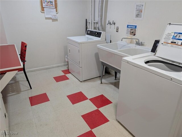 18975 Van Aken Blvd Unit 401, Shaker Heights, OH 44122 - community laundry room featuring separate washer and dryer and light floors