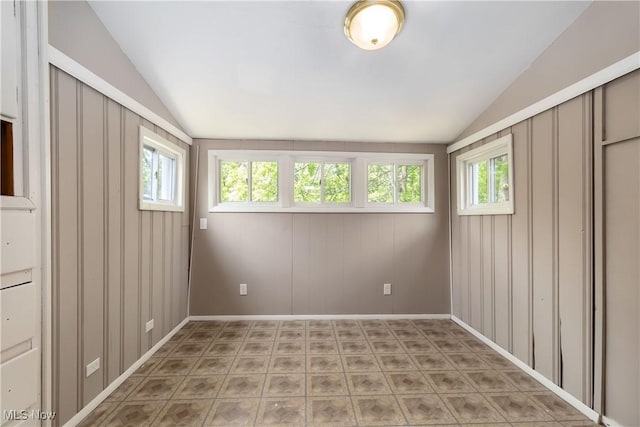 3338 E 130th St, Cleveland, OH 44120 - empty room with lofted ceiling, healthy amount of natural light, and baseboards