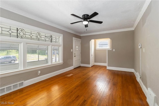 3338 E 130th St, Cleveland, OH 44120 - spare room featuring wood finished floors, plenty of natural light, baseboards, crown molding, and a ceiling fan