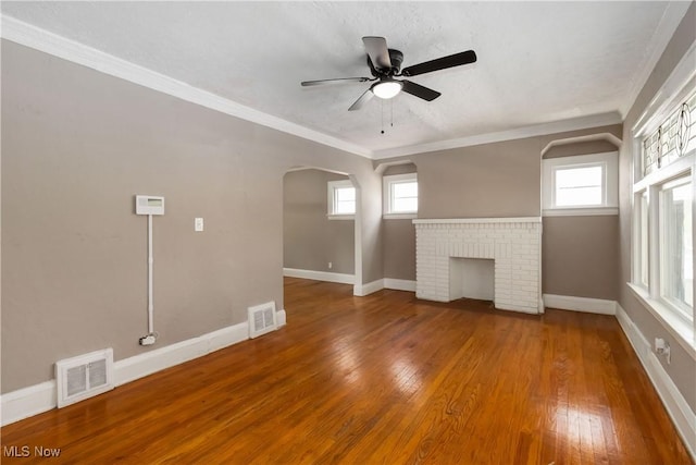 3338 E 130th St, Cleveland, OH 44120 - unfurnished living room featuring baseboards, a ceiling fan, hardwood / wood-style flooring, healthy amount of natural light, and ornamental molding