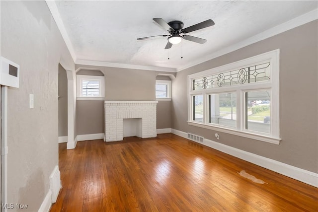 3338 E 130th St, Cleveland, OH 44120 - unfurnished living room featuring hardwood / wood-style floors, healthy amount of natural light, ornamental molding, baseboards, and ceiling fan
