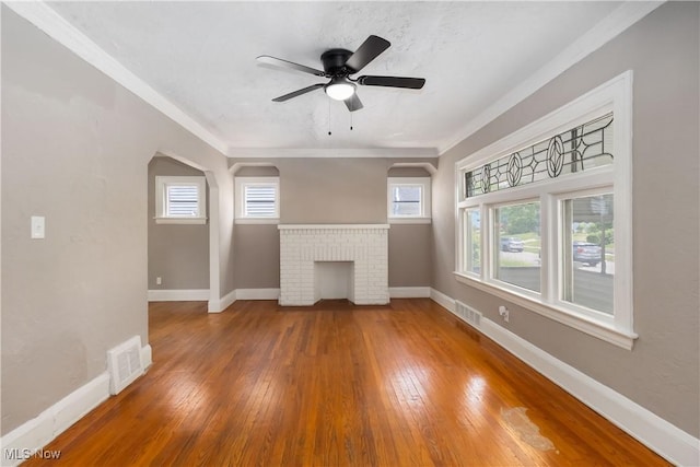 3338 E 130th St, Cleveland, OH 44120 - unfurnished living room with hardwood / wood-style floors, baseboards, ceiling fan, ornamental molding, and arched walkways
