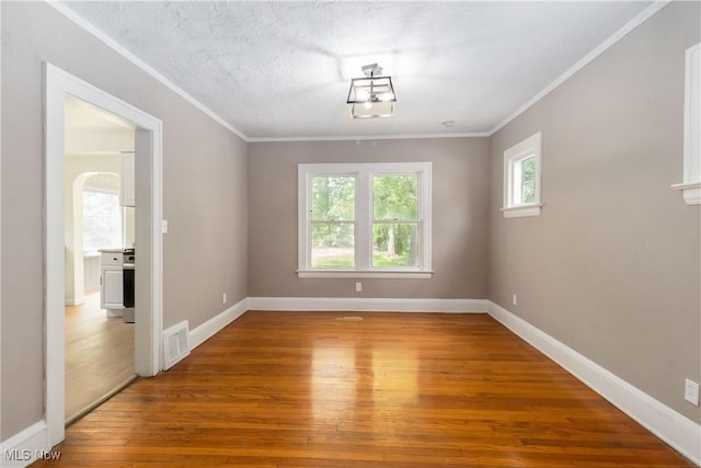 3338 E 130th St, Cleveland, OH 44120 - unfurnished room featuring hardwood / wood-style flooring, baseboards, and crown molding
