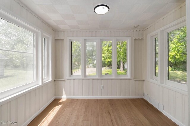 3338 E 130th St, Cleveland, OH 44120 - unfurnished sunroom featuring wood finished floors and plenty of natural light
