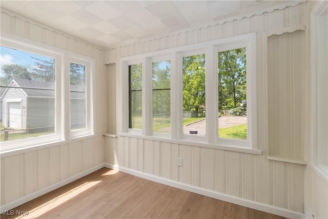 3338 E 130th St, Cleveland, OH 44120 - unfurnished sunroom featuring hardwood / wood-style flooring, healthy amount of natural light, and baseboards