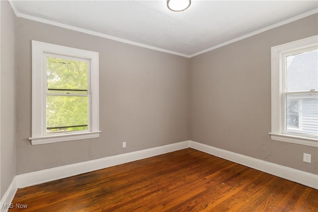 3338 E 130th St, Cleveland, OH 44120 - empty room with dark wood-type flooring, baseboards, and ornamental molding
