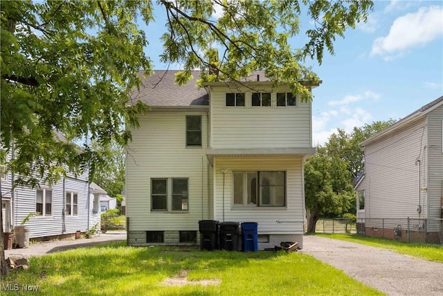3338 E 130th St, Cleveland, OH 44120 - back of property with a shingled roof