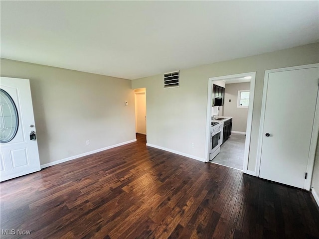 4780 E 173rd St, Cleveland, OH 44128 - unfurnished living room featuring dark wood-style flooring and baseboards