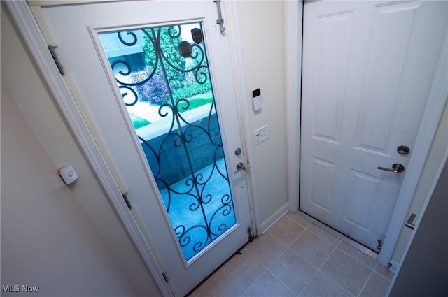 1425 Lindazzo Ave, Cleveland, OH 44114 - doorway with tile patterned flooring and baseboards
