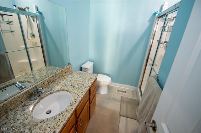 1425 Lindazzo Ave, Cleveland, OH 44114 - bathroom with a stall shower, baseboards, vanity, toilet, and tile patterned flooring