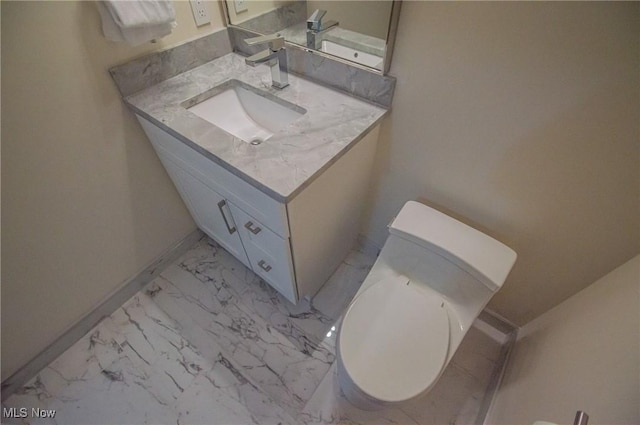 1425 Lindazzo Ave, Cleveland, OH 44114 - bathroom with vanity, marble finish flooring, toilet, and baseboards