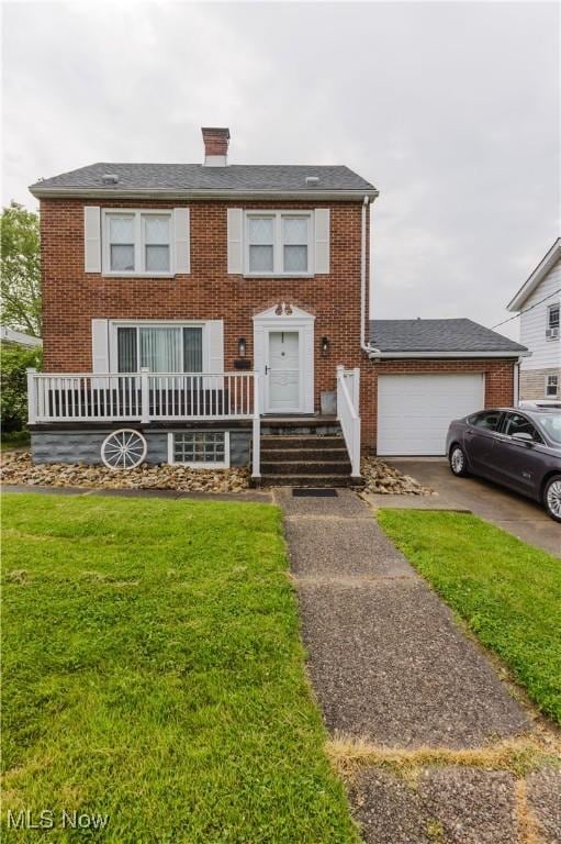 3804 Collins Way, Weirton, WV 26062 - colonial-style house featuring brick siding, a garage, a front lawn, and driveway