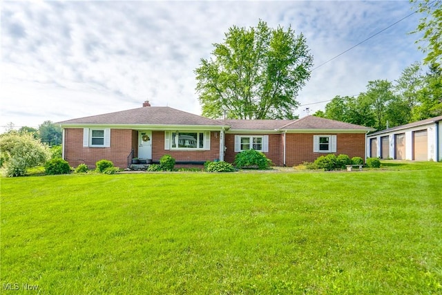 340 53rd St SW, Canton, OH 44706 - ranch-style home with brick siding, a front yard, a chimney, and a garage