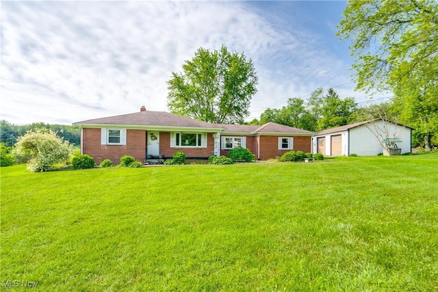 340 53rd St SW, Canton, OH 44706 - single story home with a front yard, brick siding, a chimney, and an outbuilding