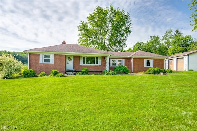 340 53rd St SW, Canton, OH 44706 - ranch-style home with brick siding, a front yard, and a chimney