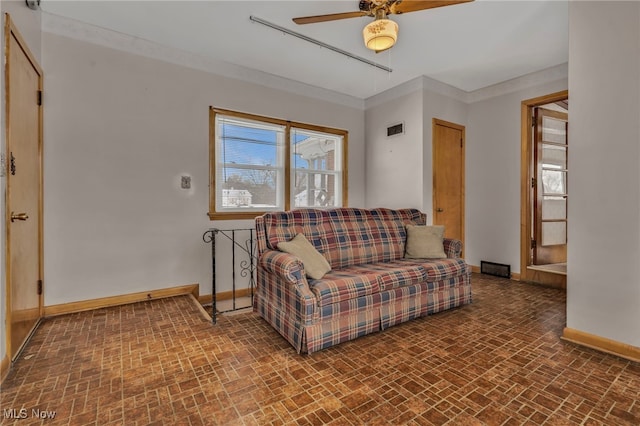 340 53rd St SW, Canton, OH 44706 - living area featuring brick patterned floors, baseboards, and a ceiling fan