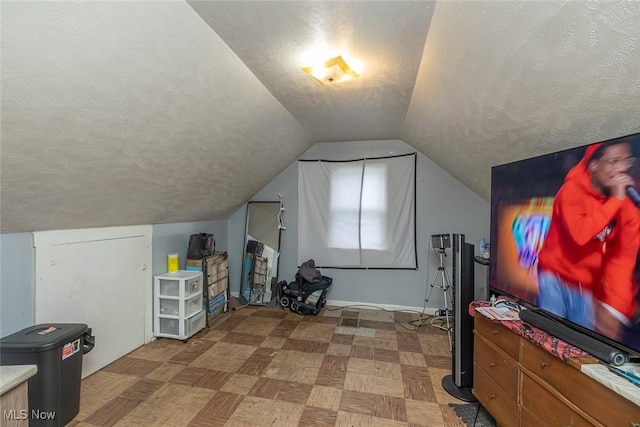 21202 Franklin Rd, Maple Heights, OH 44137 - additional living space with a textured ceiling, vaulted ceiling, and baseboards
