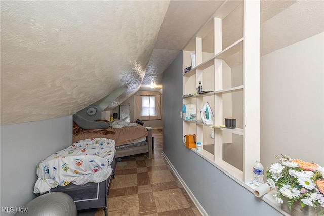 21202 Franklin Rd, Maple Heights, OH 44137 - bedroom featuring a textured ceiling, baseboards, and vaulted ceiling