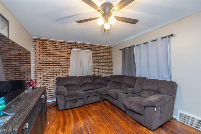 21202 Franklin Rd, Maple Heights, OH 44137 - living area with brick wall, hardwood / wood-style floors, and ceiling fan