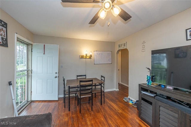 21202 Franklin Rd, Maple Heights, OH 44137 - dining space featuring arched walkways, wood finished floors, a ceiling fan, and baseboards