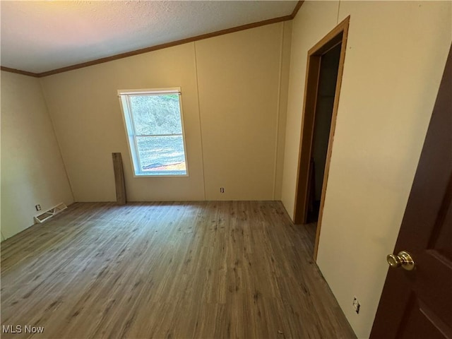48901 State Route 154, Rogers, OH 44455 - spare room with wood finished floors and crown molding