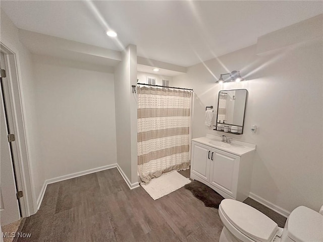 15532 Raya Oval, North Royalton, OH 44133 - bathroom featuring toilet, wood finished floors, vanity, baseboards, and recessed lighting