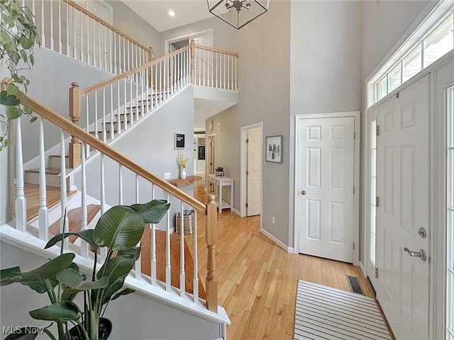 15532 Raya Oval, North Royalton, OH 44133 - foyer with a high ceiling, wood finished floors, stairs, recessed lighting, and baseboards