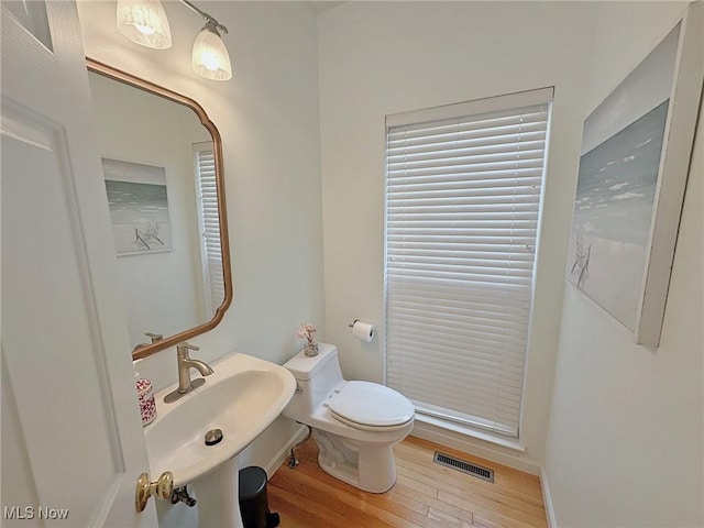15532 Raya Oval, North Royalton, OH 44133 - bathroom featuring wood finished floors, toilet, and a sink