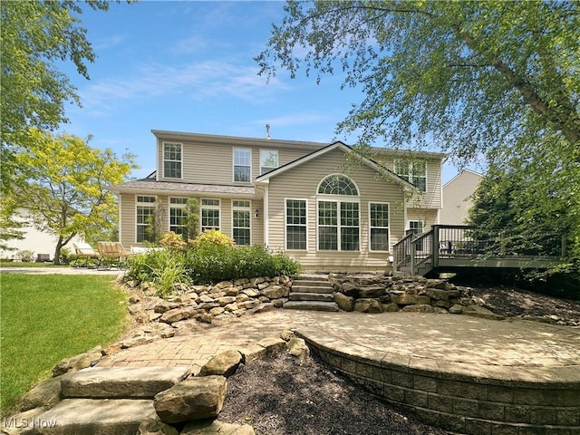 15532 Raya Oval, North Royalton, OH 44133 - rear view of house with a deck and a yard