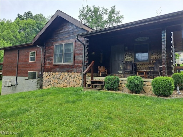 62158 Savage Rd, Cambridge, OH 43725 - view of front of home with a front lawn, a porch, and central air condition unit
