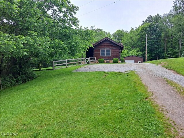 62158 Savage Rd, Cambridge, OH 43725 - view of front of home with an outbuilding, a forest view, and a detached garage