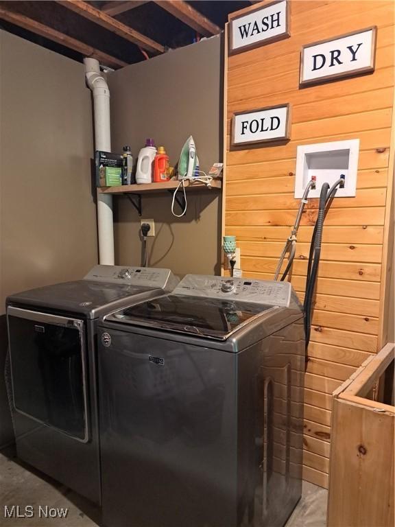 62158 Savage Rd, Cambridge, OH 43725 - washroom with separate washer and dryer and wooden walls