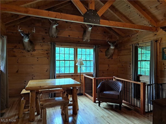 62158 Savage Rd, Cambridge, OH 43725 - living area featuring wooden walls, light wood finished floors, wooden ceiling, and an upstairs landing