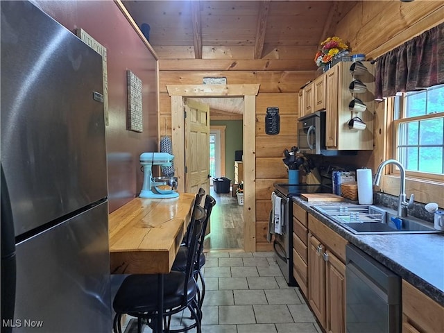 62158 Savage Rd, Cambridge, OH 43725 - kitchen with appliances with stainless steel finishes, a sink, wood ceiling with exposed beams, wood walls, and light tile patterned floors