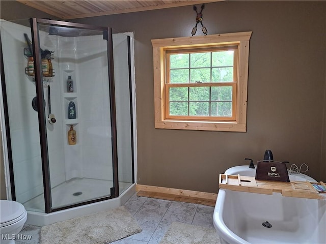 62158 Savage Rd, Cambridge, OH 43725 - full bathroom with a stall shower, baseboards, and toilet