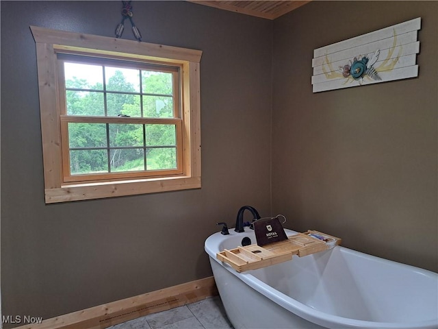62158 Savage Rd, Cambridge, OH 43725 - bathroom with a freestanding tub and baseboards