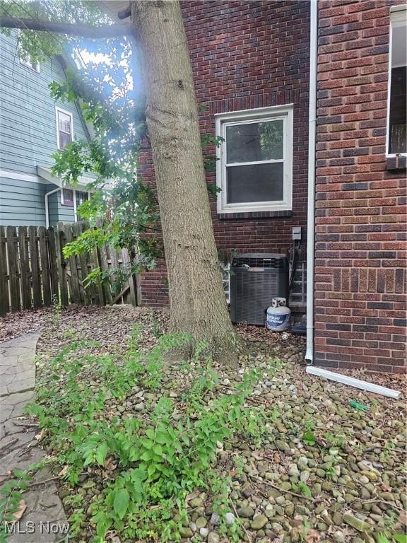 11 Adams St, Berea, OH 44017 - view of home's exterior with brick siding and a central AC unit