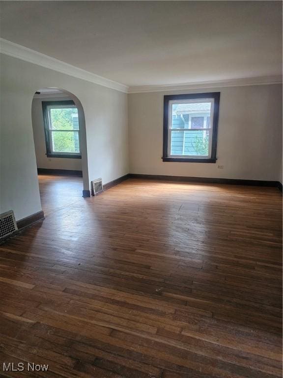 11 Adams St, Berea, OH 44017 - unfurnished room with hardwood / wood-style flooring, arched walkways, and ornamental molding