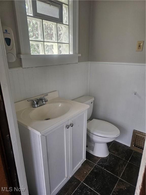 11 Adams St, Berea, OH 44017 - bathroom featuring vanity and a wainscoted wall