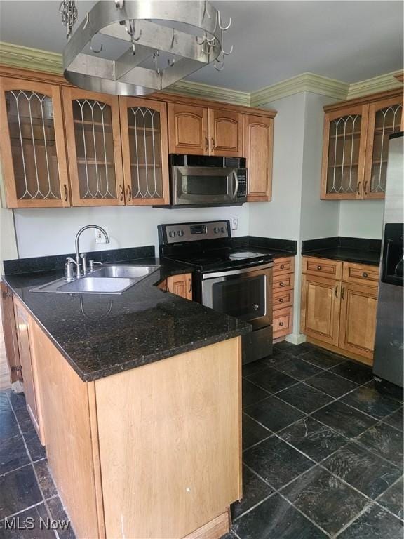 11 Adams St, Berea, OH 44017 - kitchen featuring stainless steel appliances, crown molding, glass insert cabinets, dark stone countertops, and a peninsula