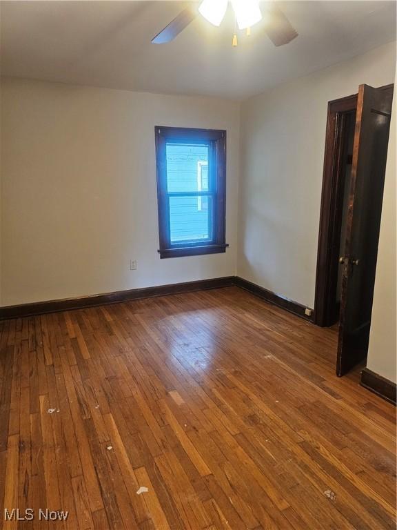 11 Adams St, Berea, OH 44017 - empty room featuring a ceiling fan and hardwood / wood-style floors