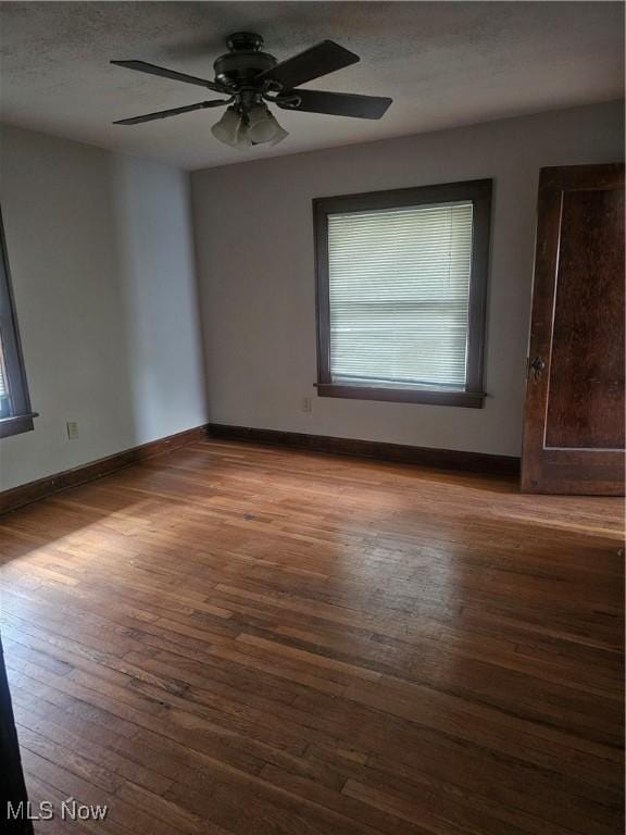 11 Adams St, Berea, OH 44017 - empty room featuring wood-type flooring and a ceiling fan