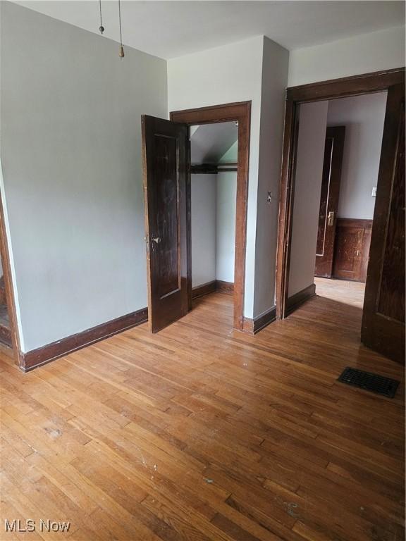 11 Adams St, Berea, OH 44017 - unfurnished bedroom featuring hardwood / wood-style floors and a closet