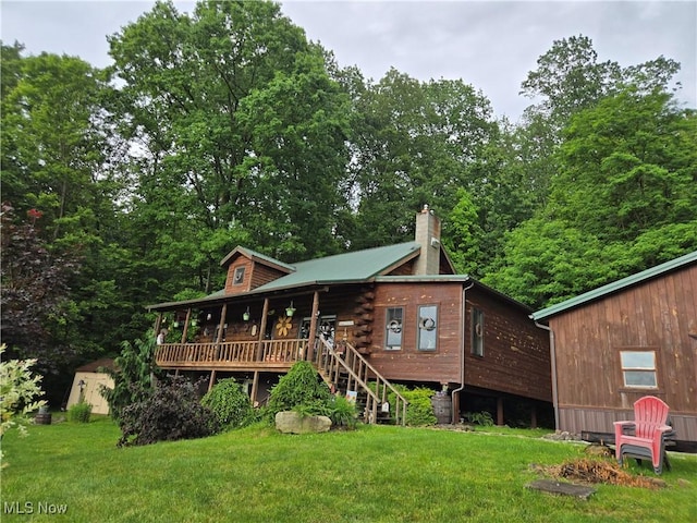 424 Avalon Rd SW, Dellroy, OH 44620 - rear view of house with a lawn, a chimney, and a porch