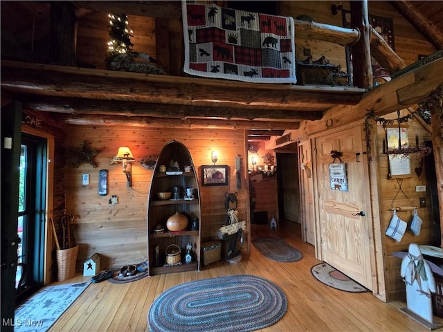 424 Avalon Rd SW, Dellroy, OH 44620 - entryway featuring hardwood / wood-style flooring, wooden walls, and beamed ceiling