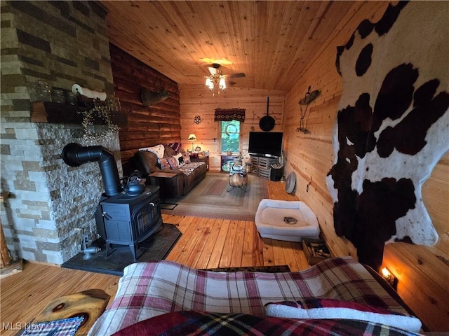 424 Avalon Rd SW, Dellroy, OH 44620 - living room featuring a wood stove, hardwood / wood-style floors, and wooden ceiling