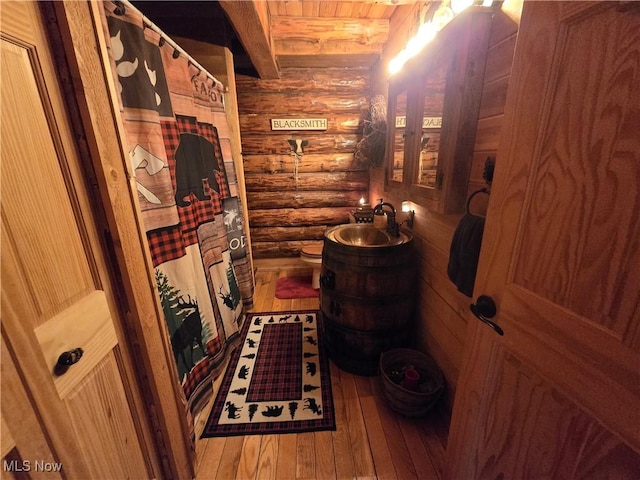 424 Avalon Rd SW, Dellroy, OH 44620 - wine area with rustic walls, hardwood / wood-style floors, and wooden ceiling with exposed beams