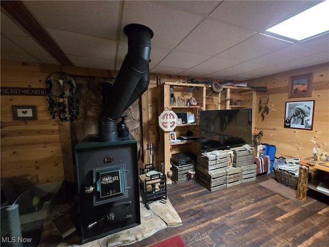 424 Avalon Rd SW, Dellroy, OH 44620 - finished basement featuring wood walls, a drop ceiling, wood finished floors, and a wood stove