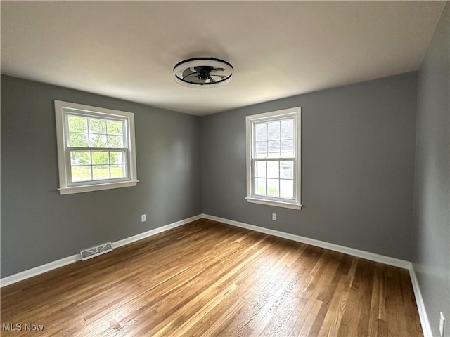 4570 N Leavitt Rd NW, Warren, OH 44485 - spare room with plenty of natural light, hardwood / wood-style flooring, and baseboards